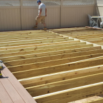 Composite deck installation by deck builders in Brooklyn